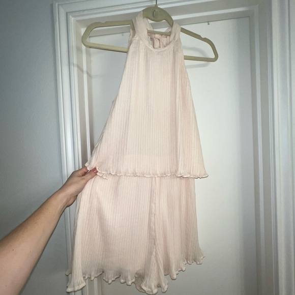 Adorable cream chiffon ruffle short romper with tie back. Open winged back. - Picture 12 of 13